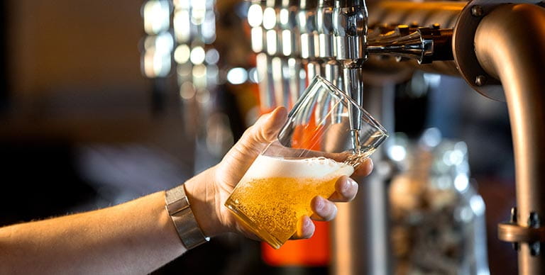 Beer being served in a pub